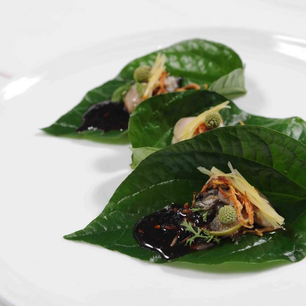 Miang betel leaves of Irish creamy oysters with ginger, roasted coconut, popinac & galangal jam