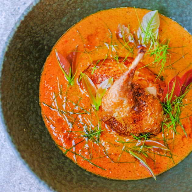 Quail, lacquered with pure palm sugar and wild honey served with Kanchanaburi red curry & sour leaves